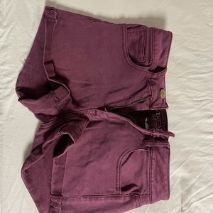 Burgundy shorts.